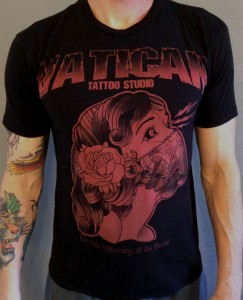 T-shirt printed with discharge + red pigment.